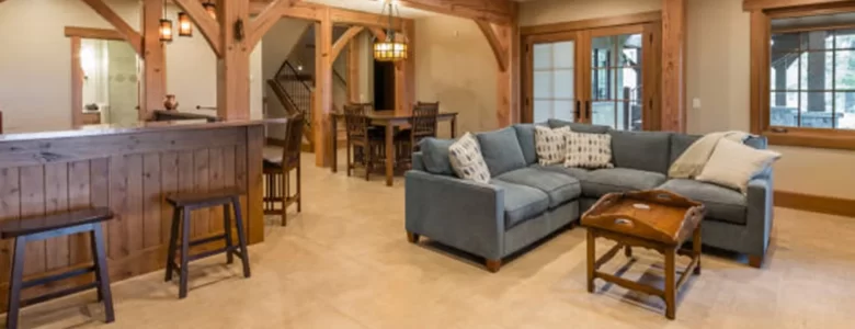 Finished basement family room with built-in shelving and recessed lighting in New Jersey home