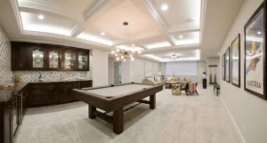 Remodeled basement living area with finished flooring and freshly painted walls in a New Jersey home
