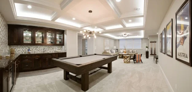 Remodeled basement living area with finished flooring and freshly painted walls in a New Jersey home